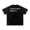 black oversized graphic t shirt with back text knows about you minimalist streetwear
